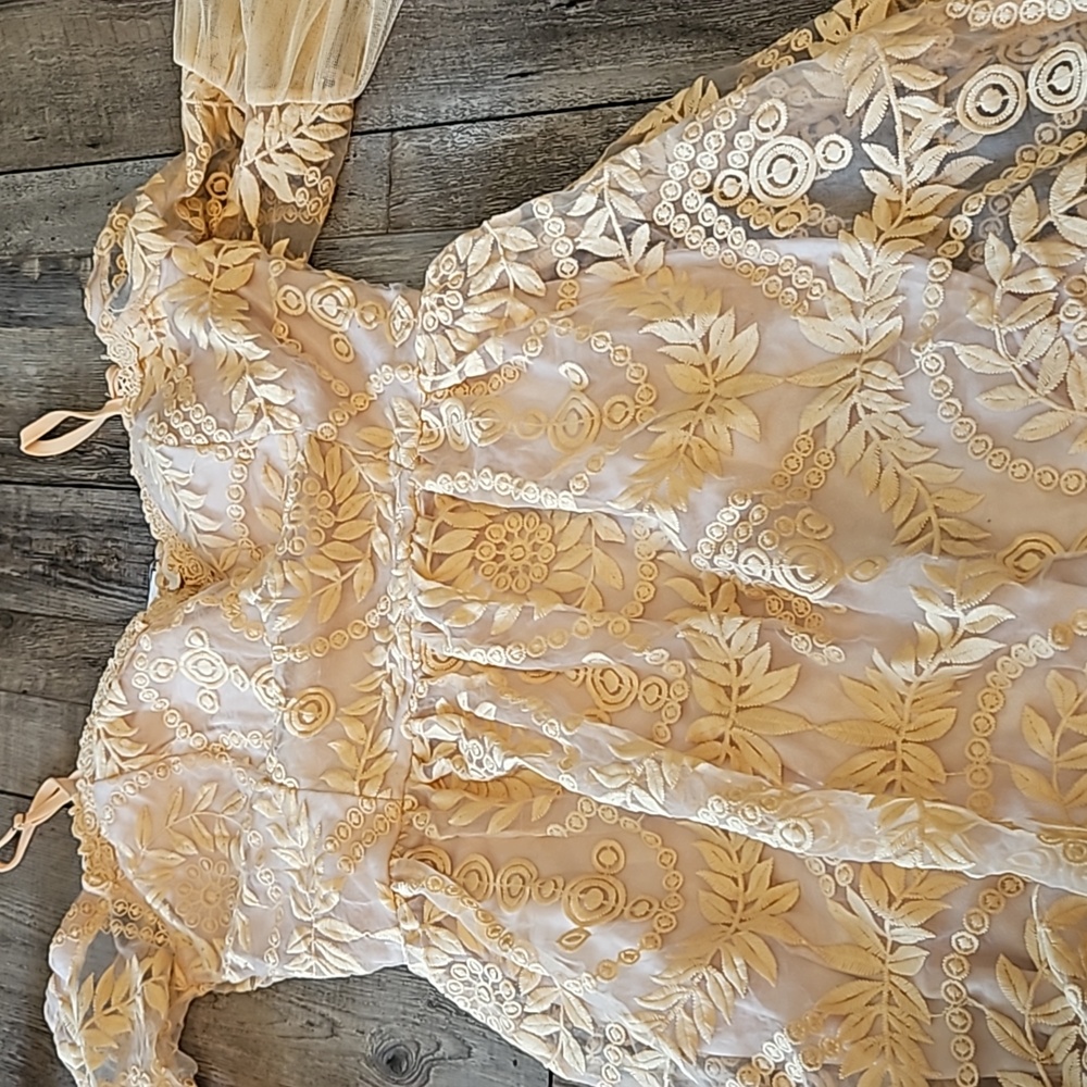 A. Peach. Size Small dress. Off white, lace. Short dress. Has a built in bra.